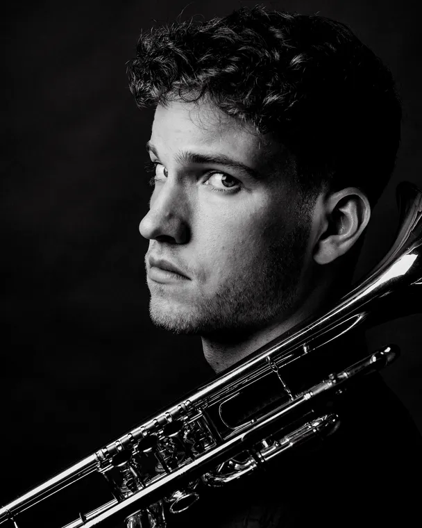 Valentin Annerbo, portrait with trumpet over the shoulder.